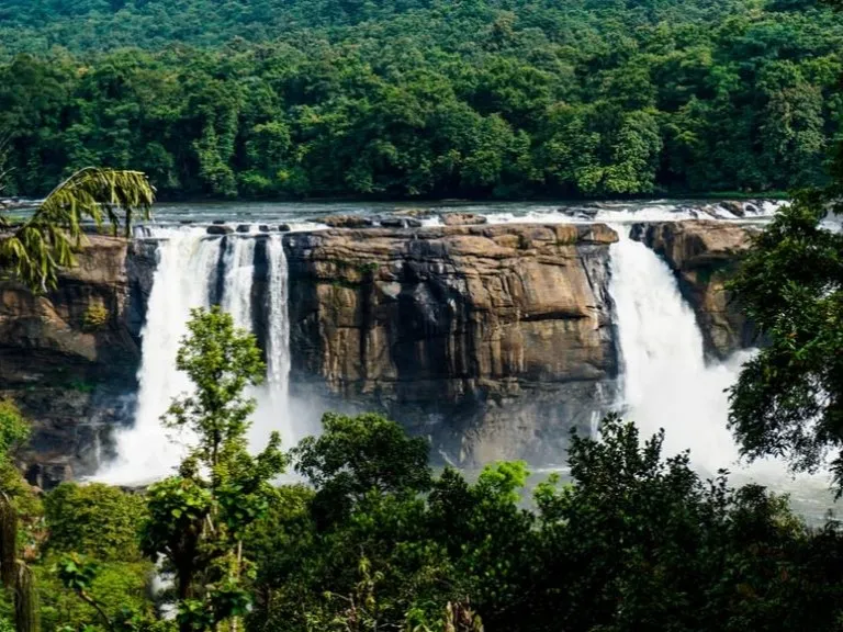Majestic Athirappilly Waterfalls cascading through the green forests of Kerala